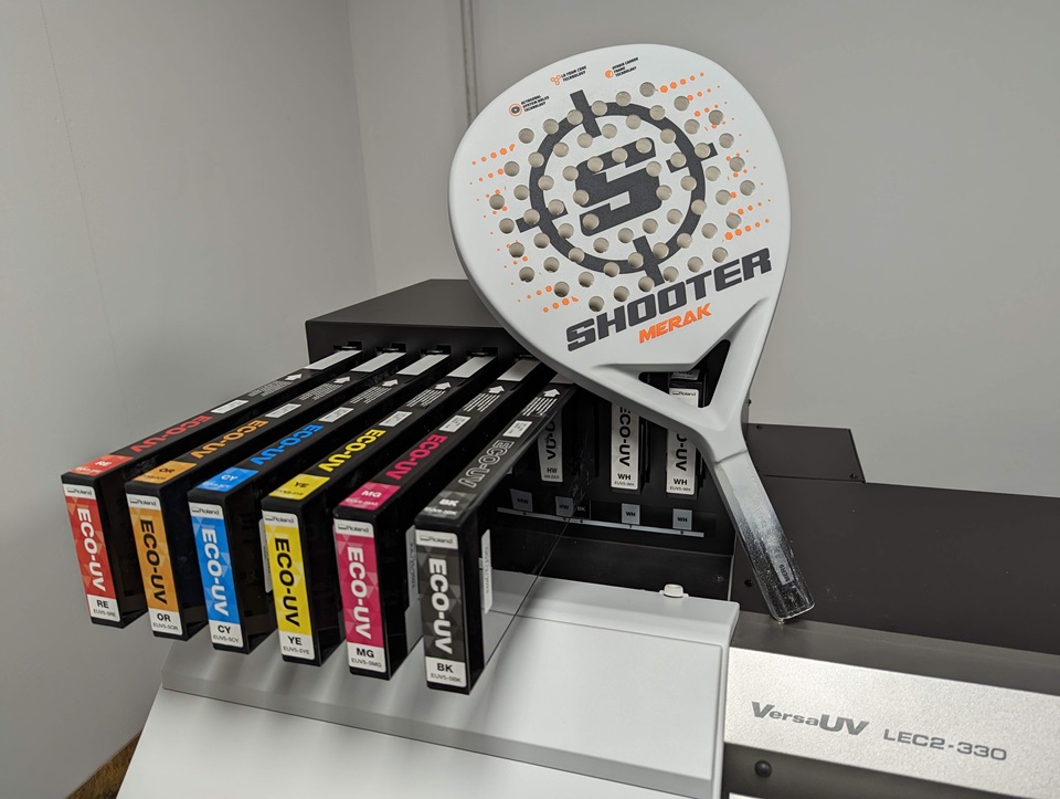 Shooter Padel - A customised padel racquet placed on a Roland DG VersaUV LEC2-330 printer