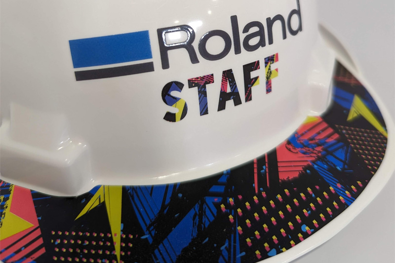 A white hard hat with colorful designs