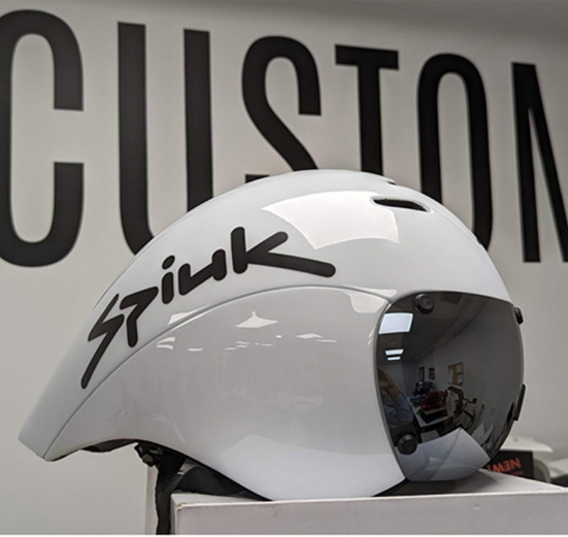 A white bike helmet with black cut-vinyl lettering