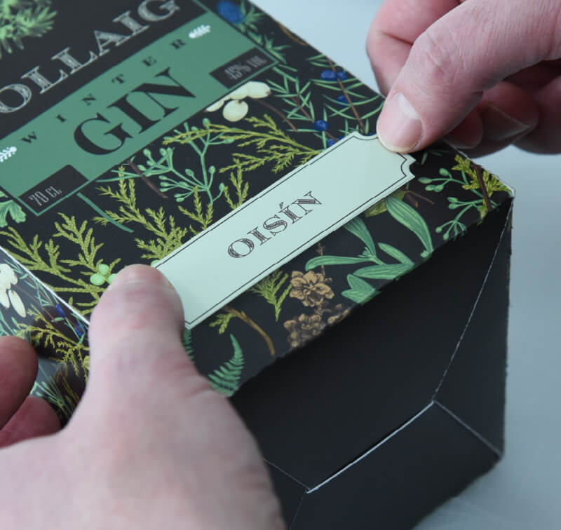 Applying a name sticker to personalised packaging