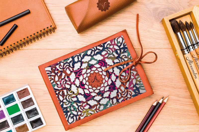 Add stylish decorative details to leather notebooks using UV printers and laser engravers