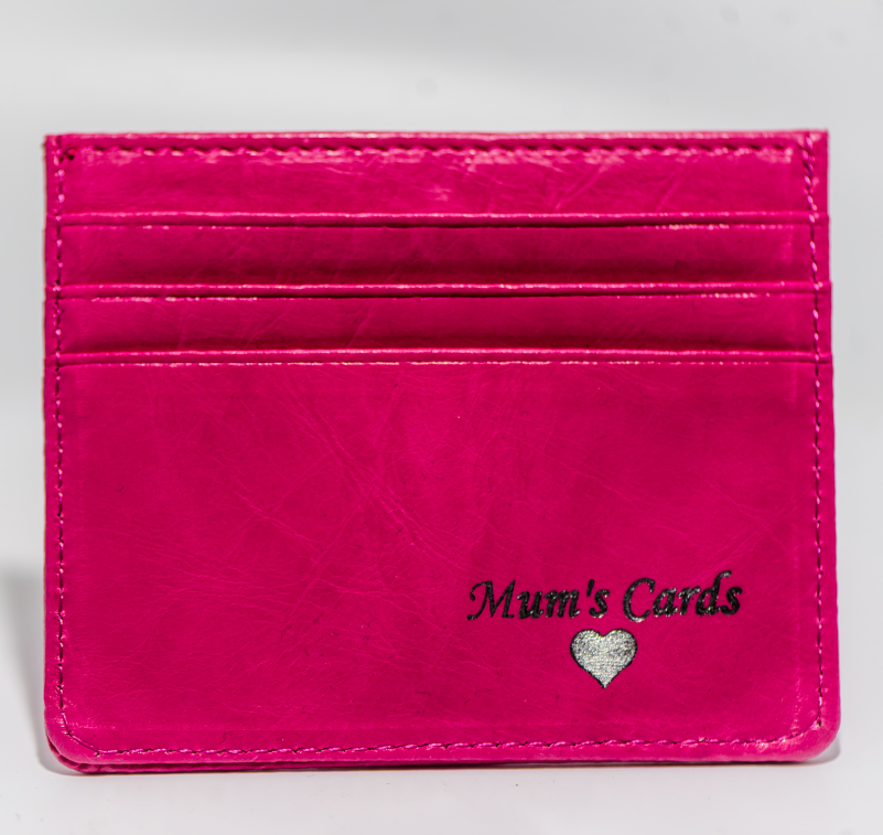 A pink leather card holder with personalised print
