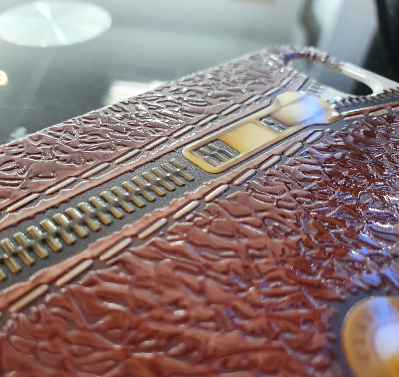 Close up of a phone case with printed leather effect