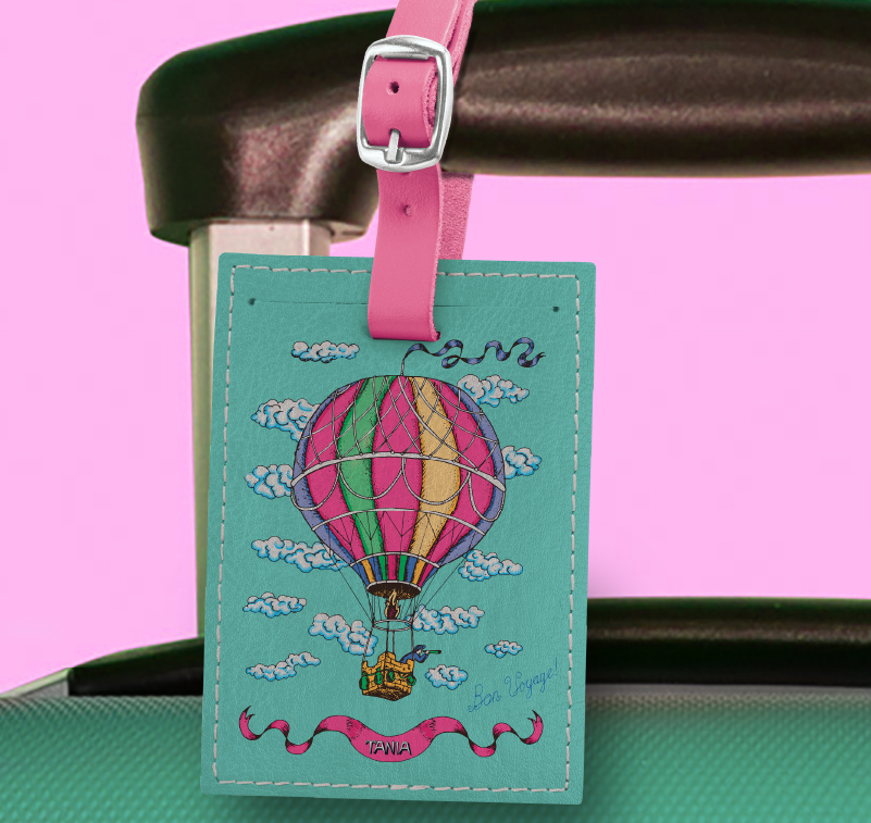 A leather luggage tag with custom printed graphics