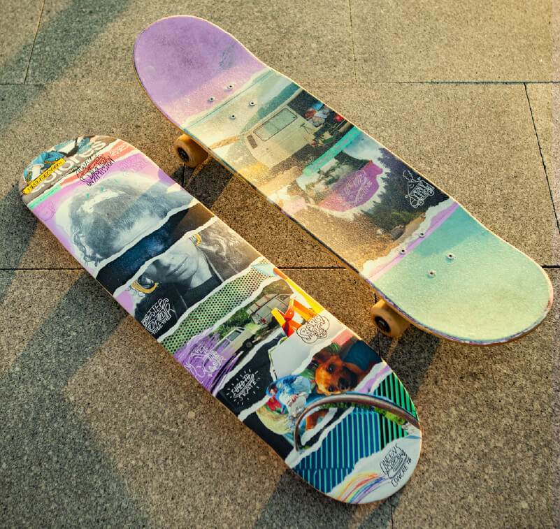 A pair of skateboards with custom printed wraps