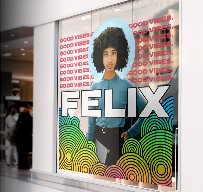Printed window graphics promoting a clothing brand 