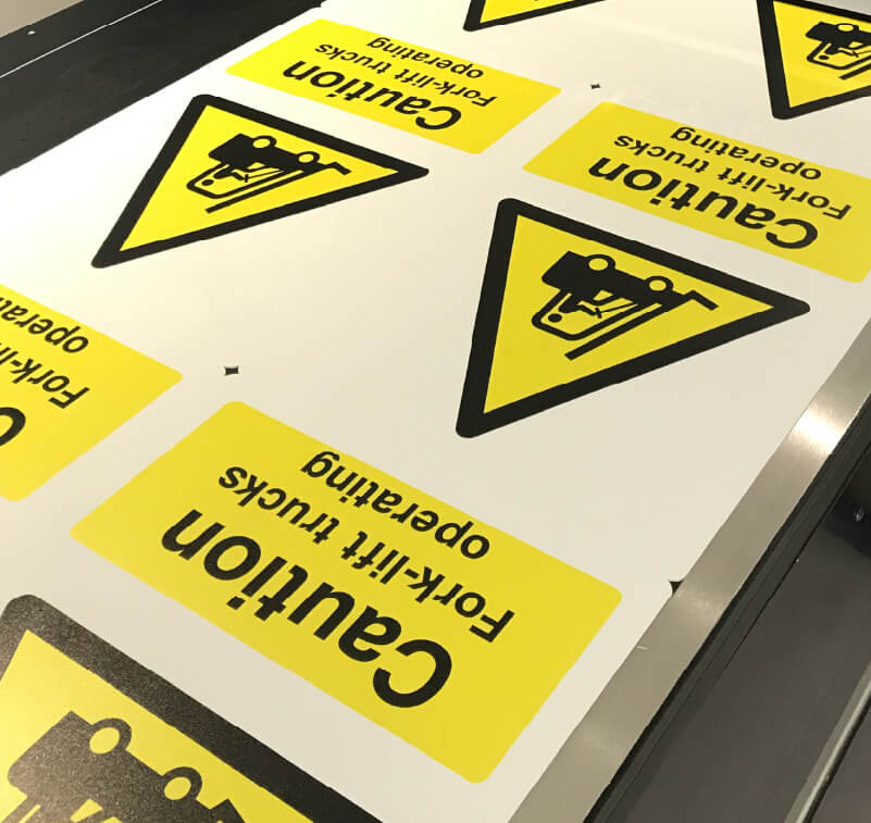 Safety signage printed on rigid material using a flatbed printer