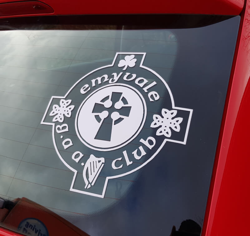 A car window with a sports club sticker