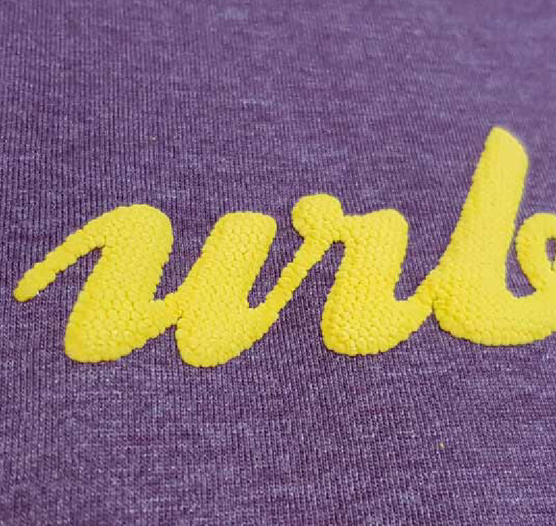 Close-up of expanding vinyl cut and applied to a sweatshirt