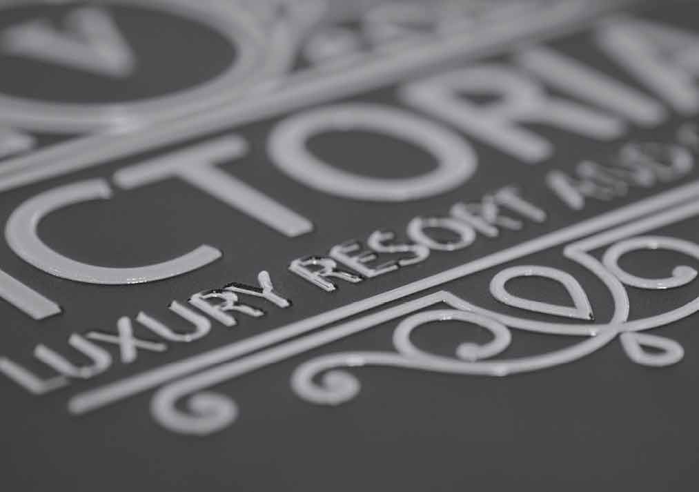 Build up text with gloss ink to add a touch of luxury