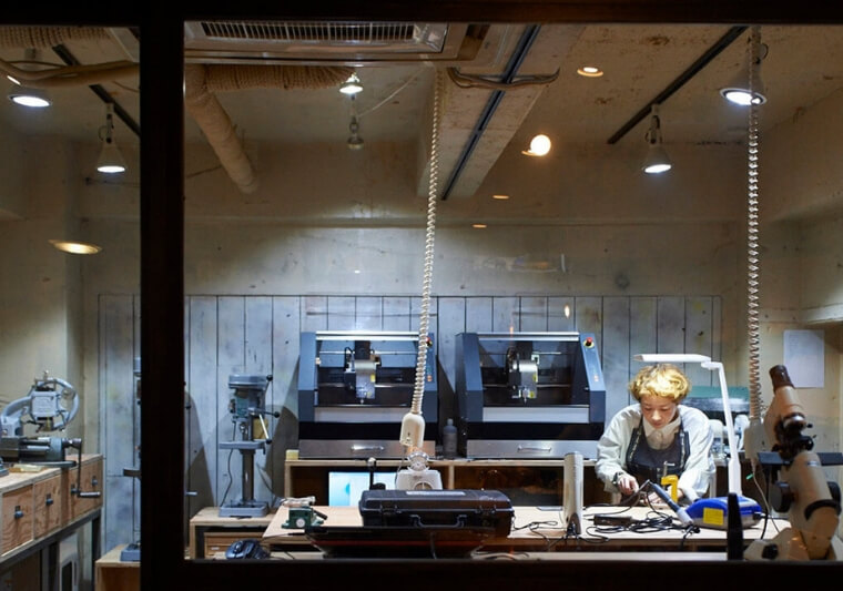 Artisan Moe Kawatani machining bespoke eyewear in the fabricating studio