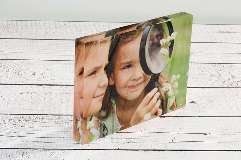 For acrylic block photos, CMYK ink is printed on the reverse and covered with a white layer