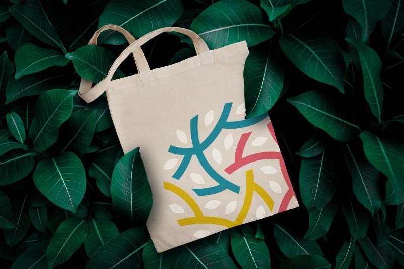 Canvas tote bag featuring logo