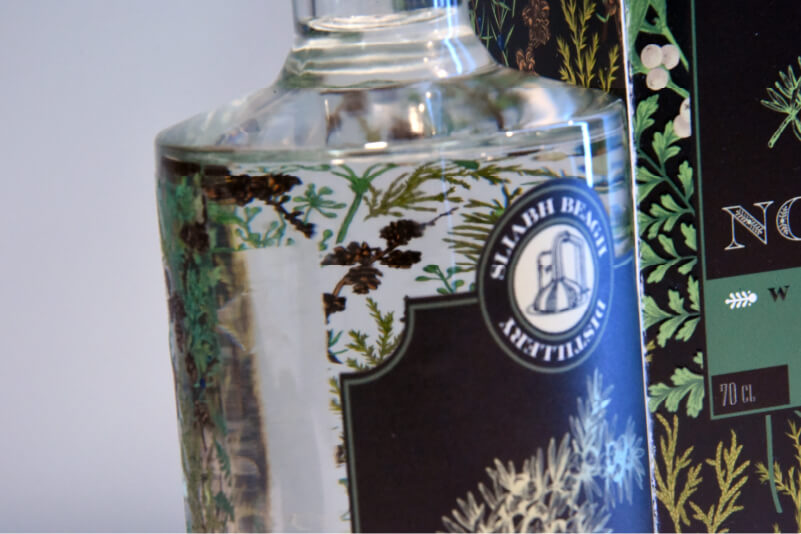 Fron gin bottle label with packaging box in the background
