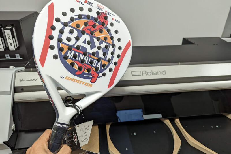 A custom printed padel racket with a flatbed UV printer