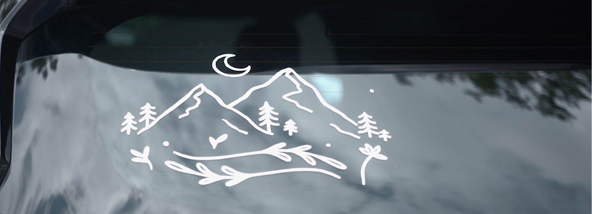 A mountain scene car window sticker
