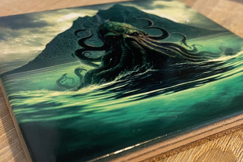 A coaster with a sea monster printed using UV gloss ink