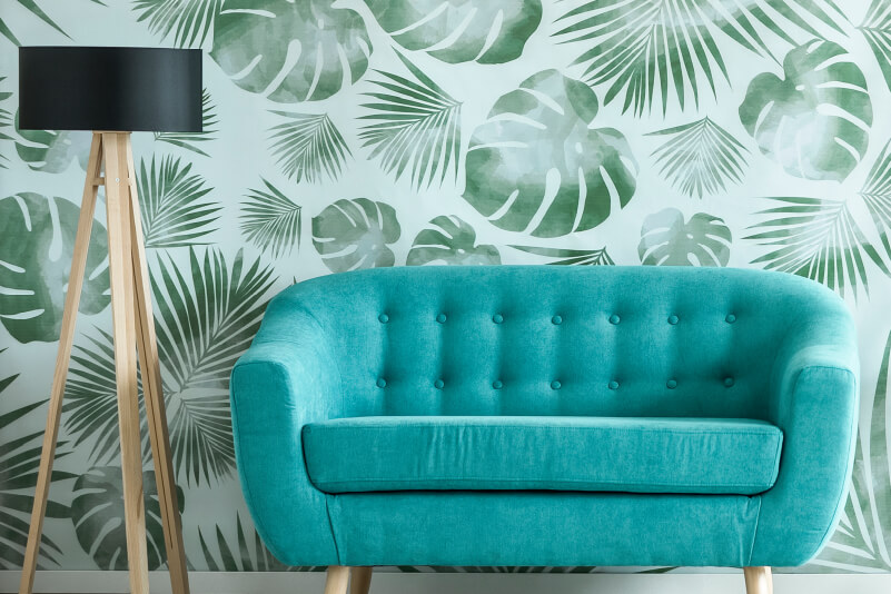 Stylish printed wall cover behind a couch