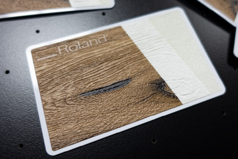 Print sample showing how printed wood-grain is achieved with several layers.