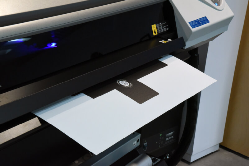 UV printer/cutter producing a folding card box