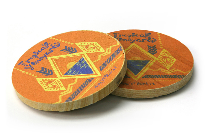 A pair of coasters with a design on them