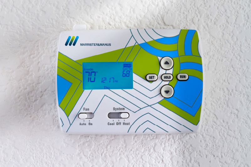 A household thermostat direct-printed with brand colours
