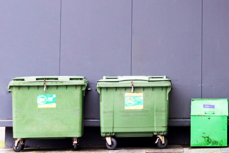 A group of green waste bins