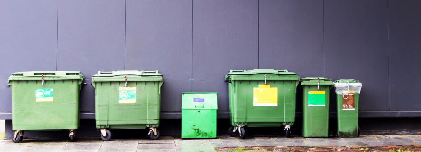 A group of green waste bins