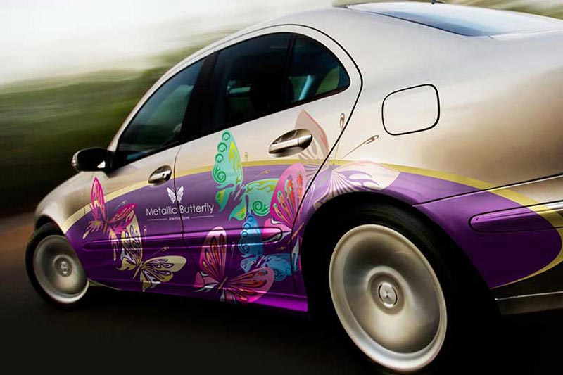 A car wrapped with butterfly graphics