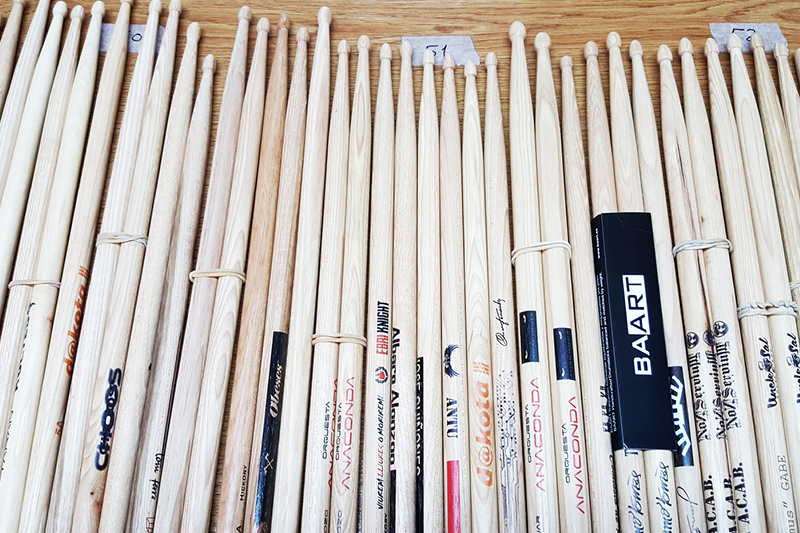 BAART prints logos, names and designs onto its handmade drumsticks