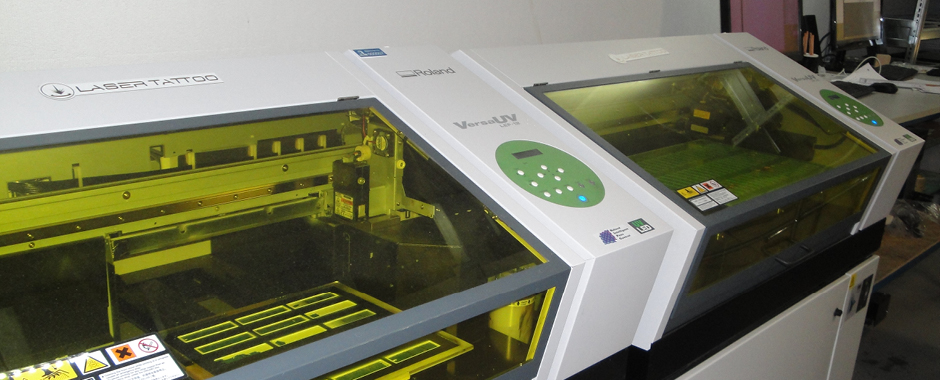 Laser Tattoo runs two VersaUV LEF printers alongside its engraving kit