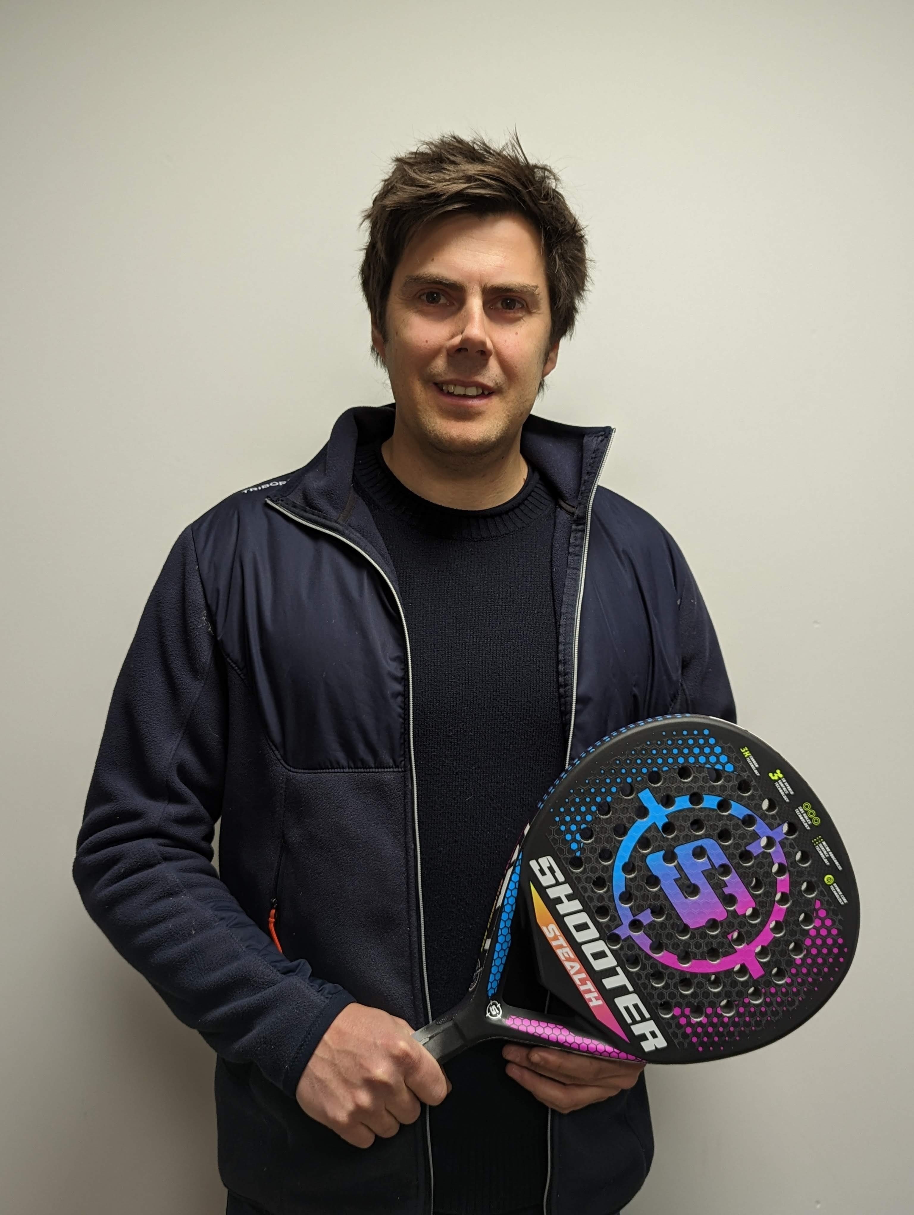 One of the founders showing two personalized racquets